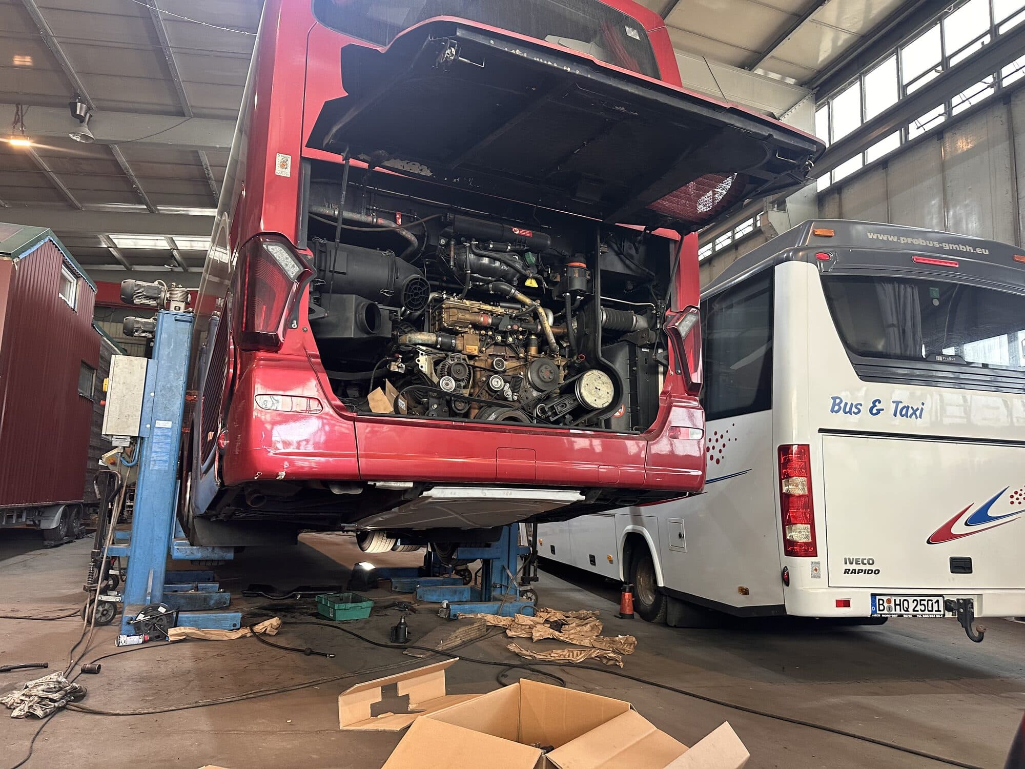 A BerlinBus.DE bus being serviced in the workshop