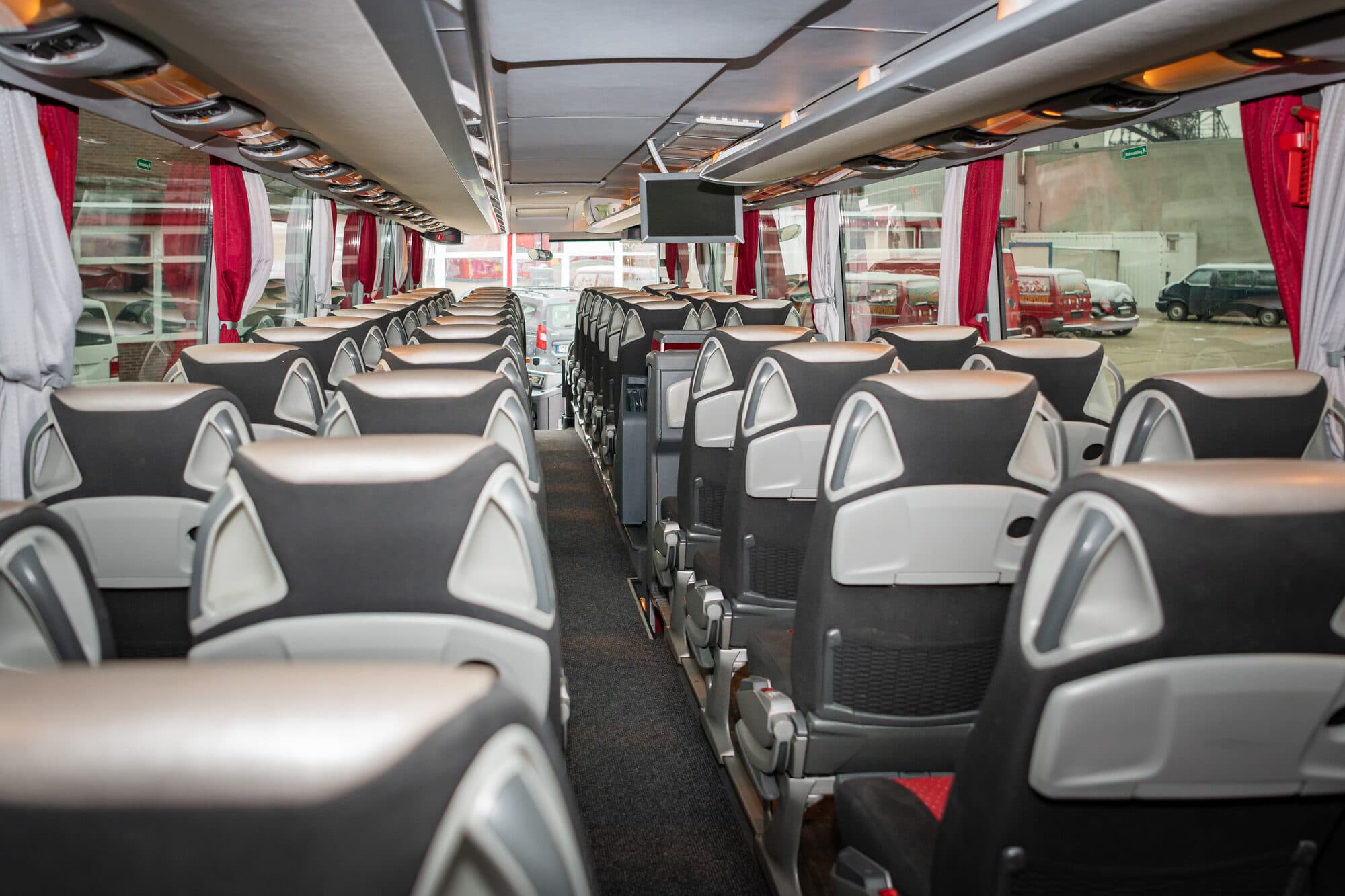 Interior of a coach looking down the centre aisle