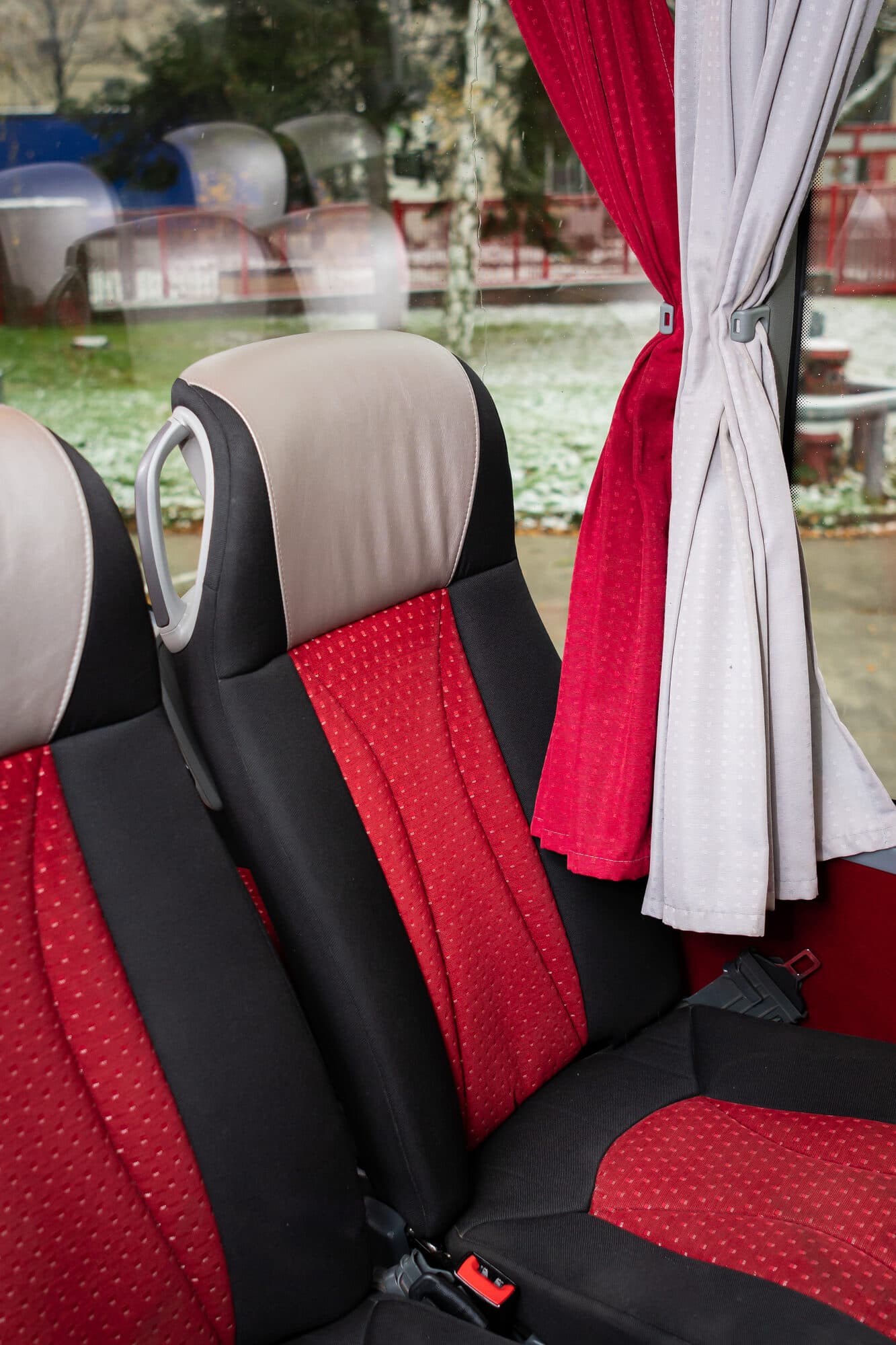 Coach seat with armrest and headrest