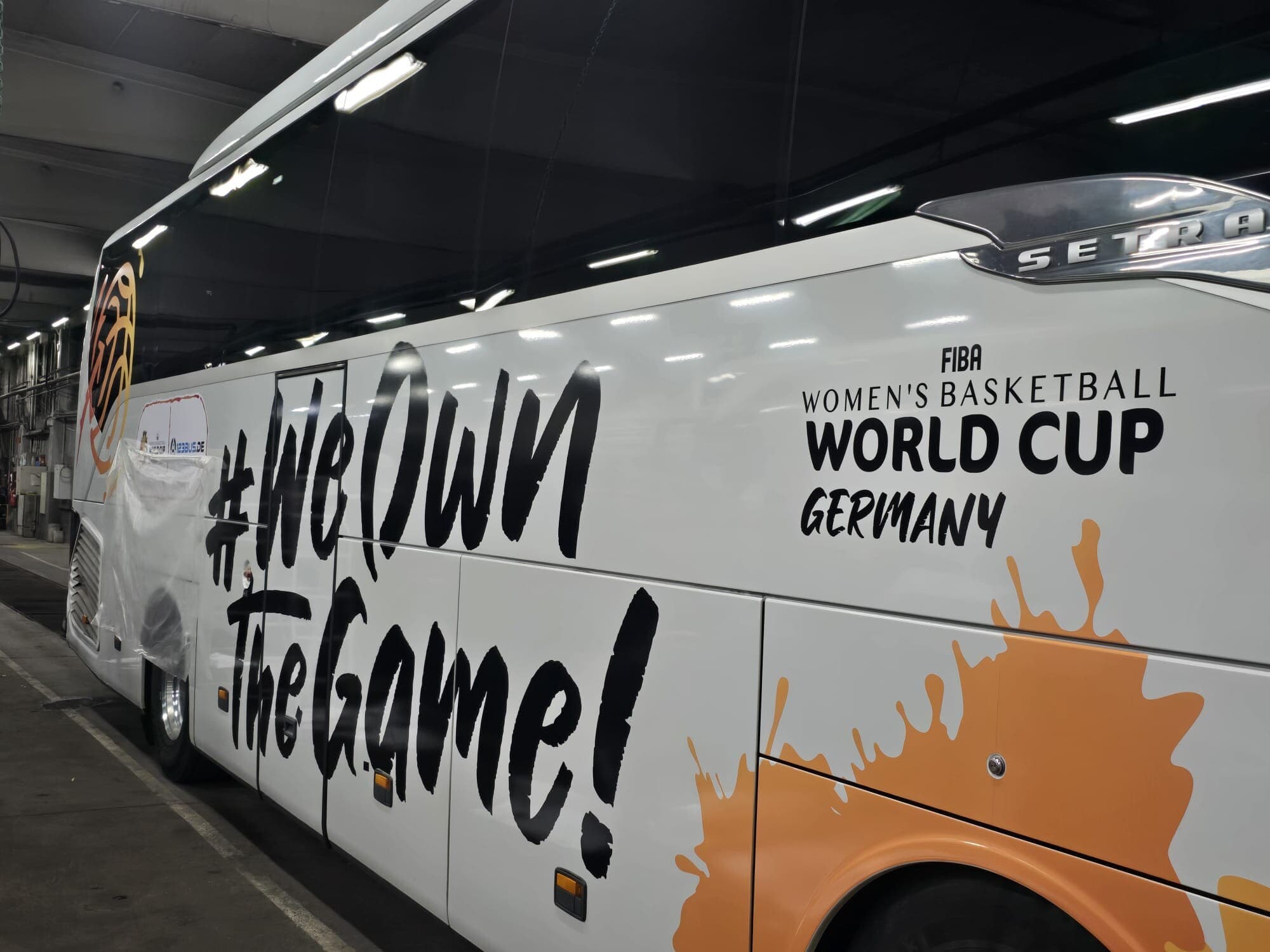 A bus being wrapped for an event in the BerlinBus.DE hall